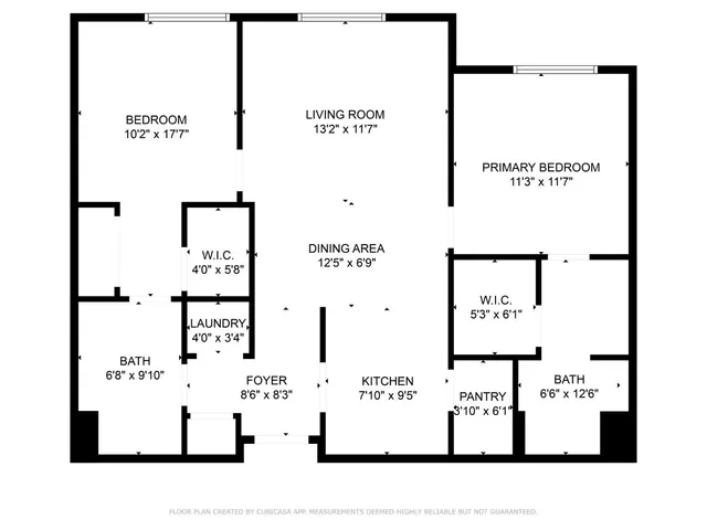 a view of backyard with outdoor seating and plants
