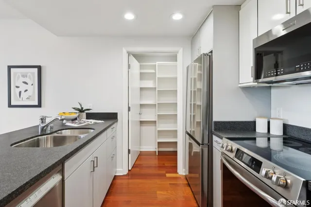 a kitchen that has a sink and a stove