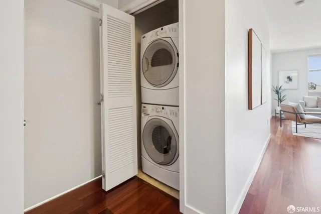 a view of a storage and utility room with wooden floor
