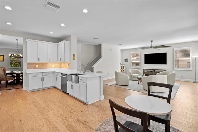 a bedroom with a bed and a ceiling fan