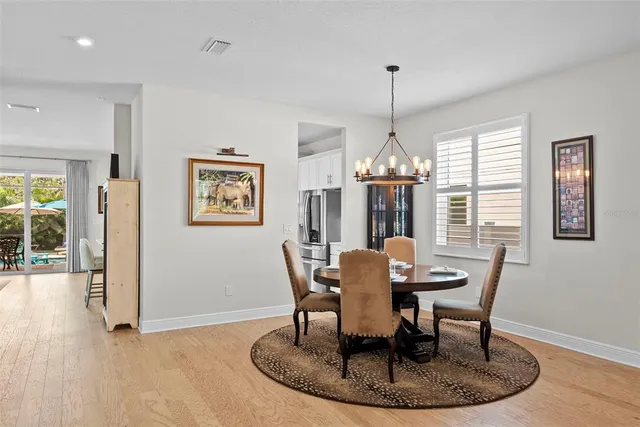 a bathroom with a granite countertop sink toilet mirror and shower