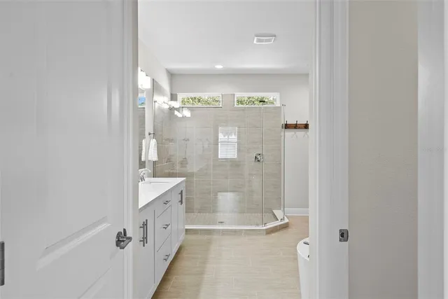 a bedroom with furniture and wooden floor