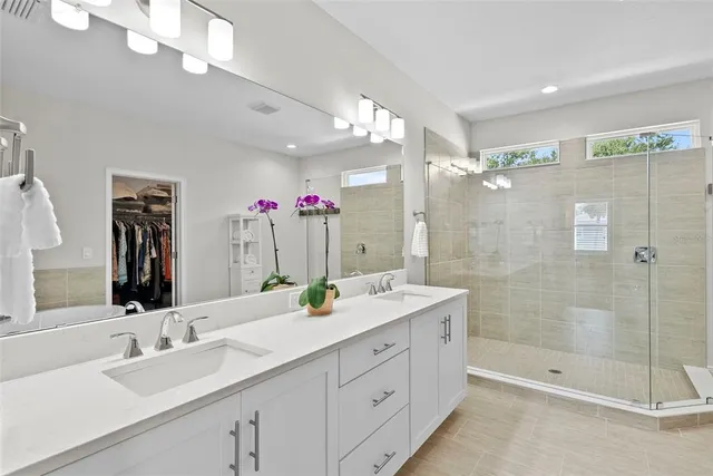 a view of a patio with a table and chairs under an umbrella