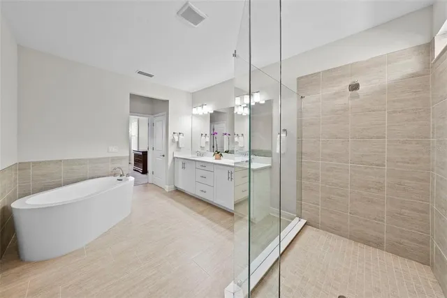 a view of a patio with a table and chairs under an umbrella