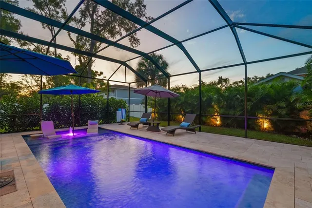 a living room with furniture ceiling fan and a window