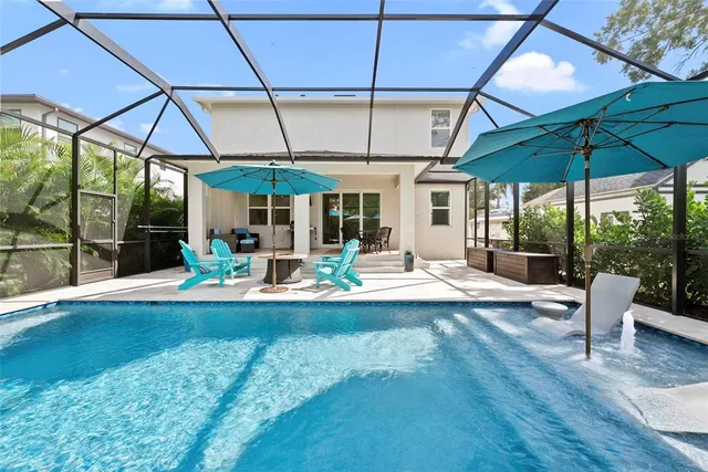 a living room with furniture a wooden floor and a window