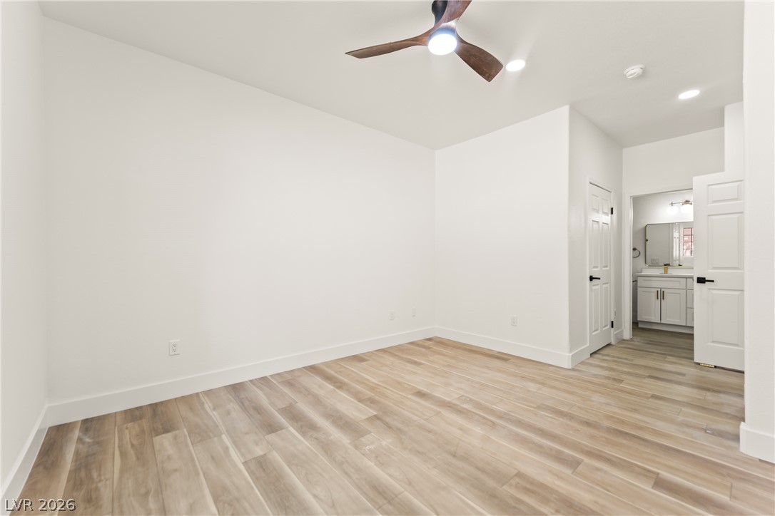 4730 East Craig Road, Unit 1053 Las Vegas, NV 89115 - Photo 14 of 32 A well-proportioned bedroom with resilient flooring, illuminated by recessed lighting and a ceiling fan.