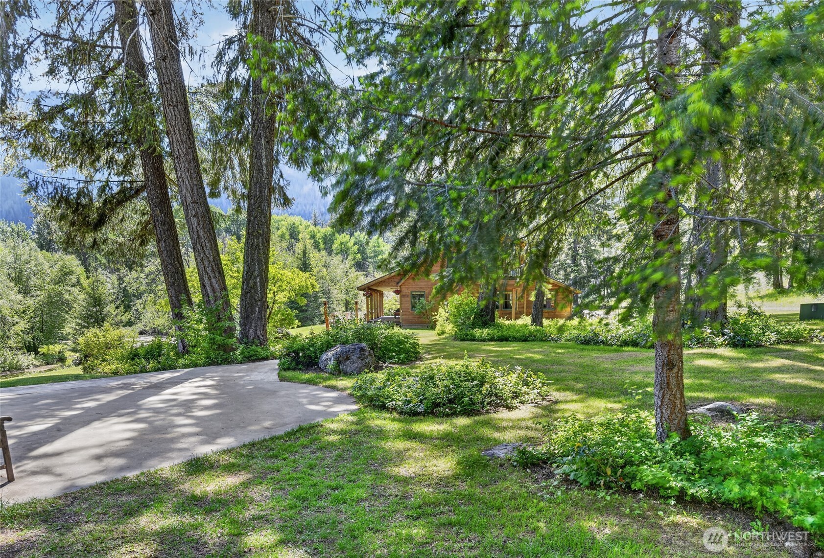 19 2 Rivers Road Mazama, WA 98833 - Photo 31 of 40 a view of a yard with a tree