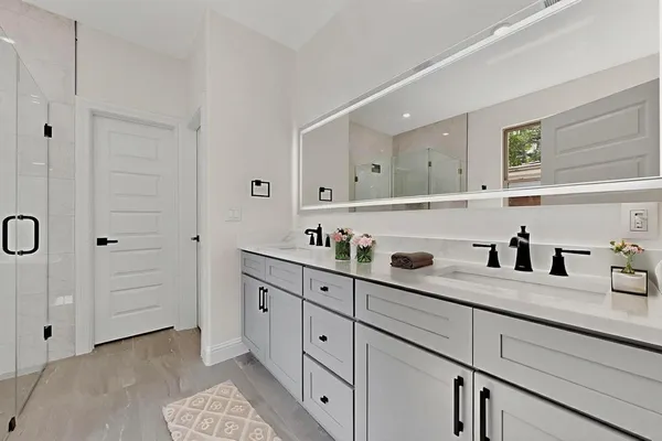 a bedroom with a bed and glass window
