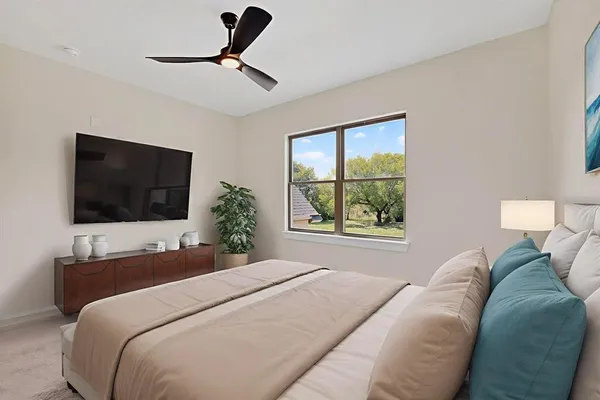 a bedroom with a bed and a window