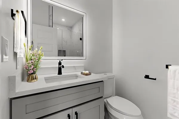 a bedroom with a bed and a potted plant