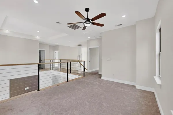a view of a balcony with wooden floor
