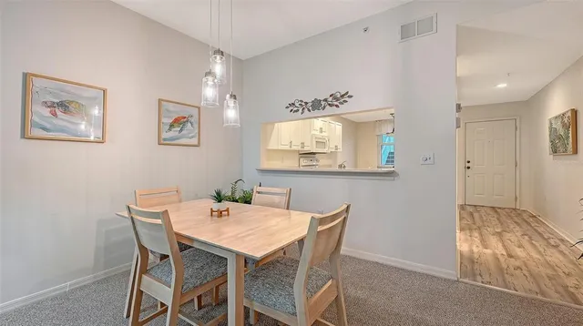 a view of a dining room with furniture