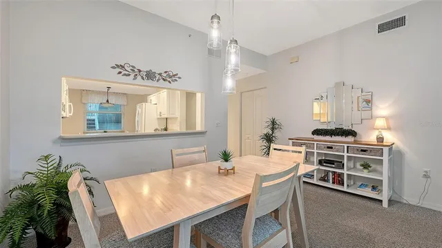 a dining room with a table chairs and a stove