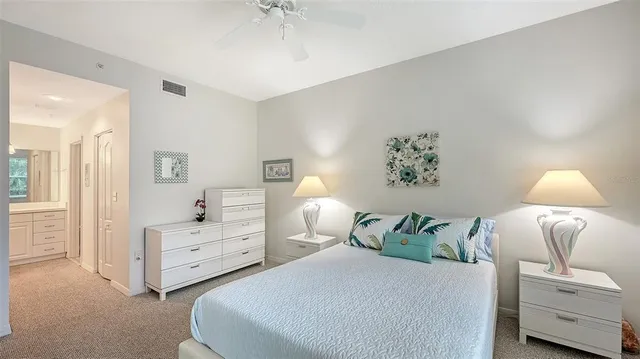 a bedroom with a bed and a lamp