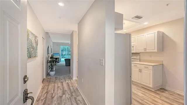 a view of a kitchen from the hallway
