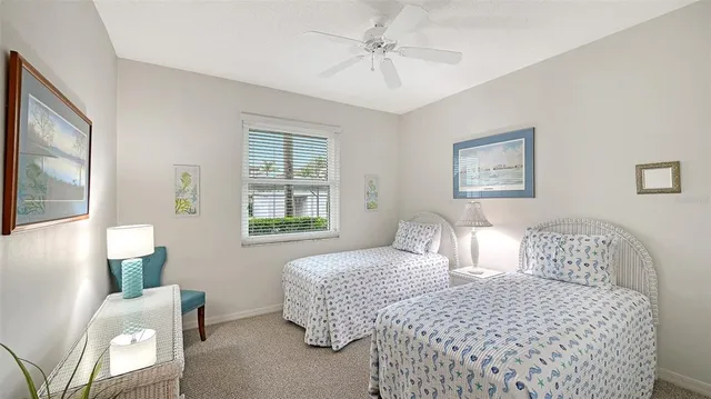 a bedroom with bed and window