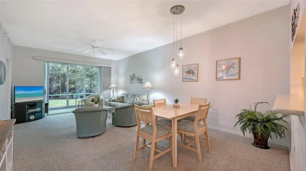 a dining room with a large window and table