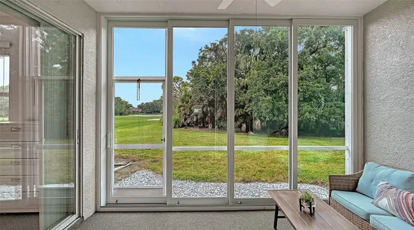 a view of a room that has a bed in it
