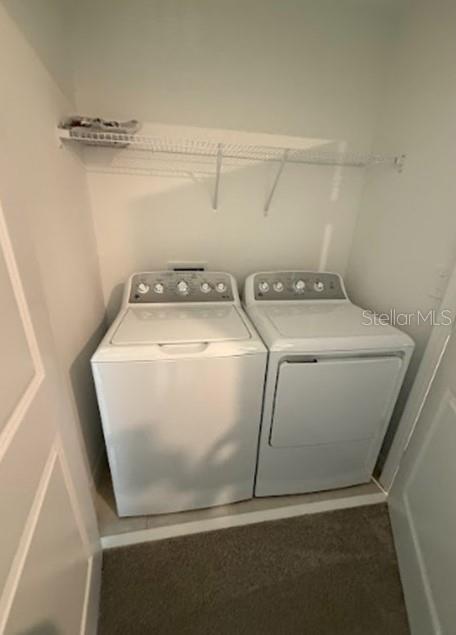 2927 Skyline Loop Kissimmee, FL 34758 - Photo 14 of 17 a utility room with dryer and washer