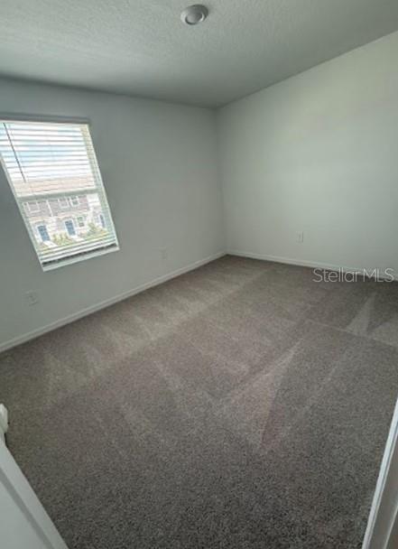 2927 Skyline Loop Kissimmee, FL 34758 - Photo 15 of 17 an empty room with a window