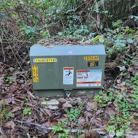 a sign that is sitting on a rock
