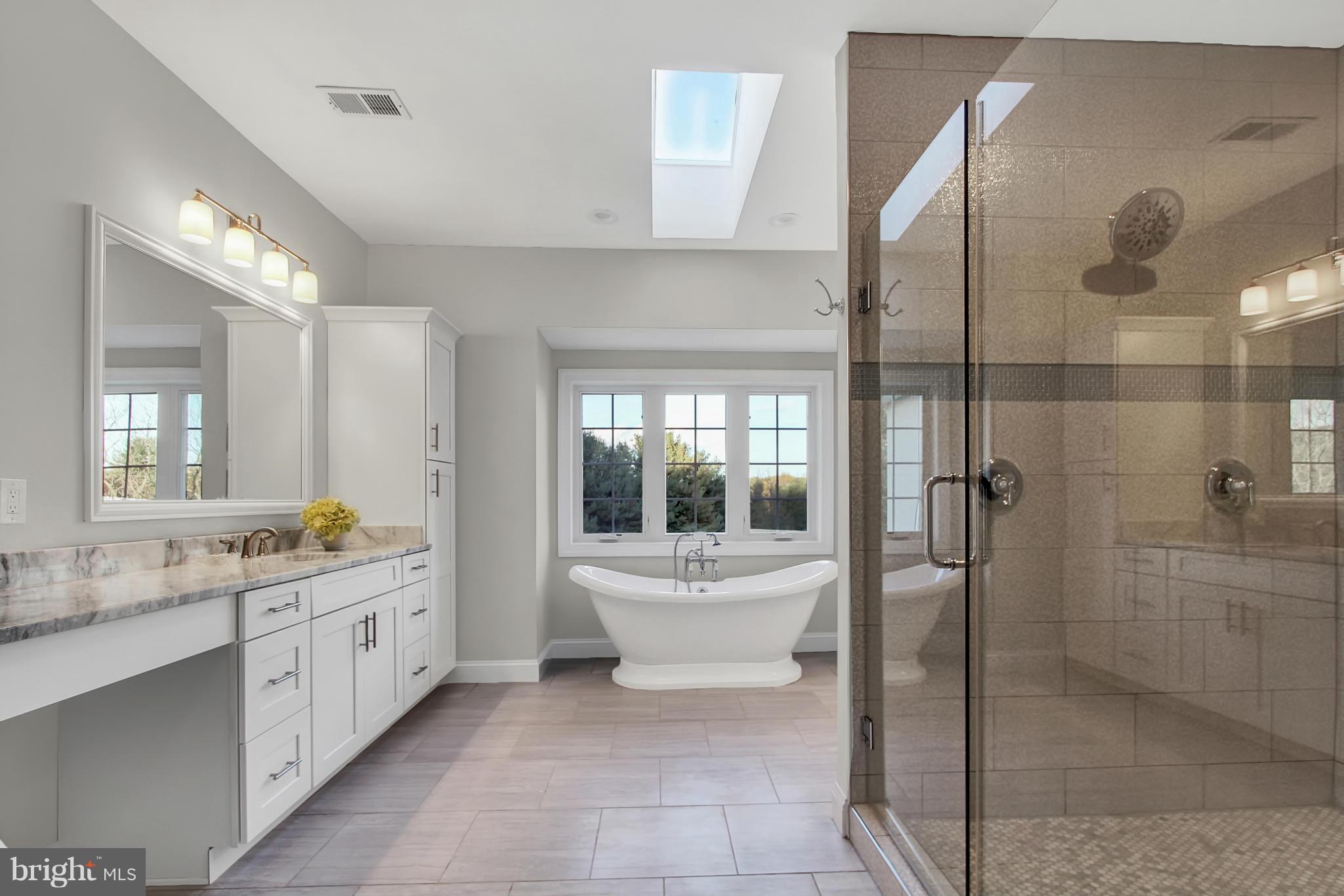 1904 Broadway Road Lutherville-Timonium, MD 21093 - Photo 20 of 30 a bathroom with a double vanity sink mirror and shower
