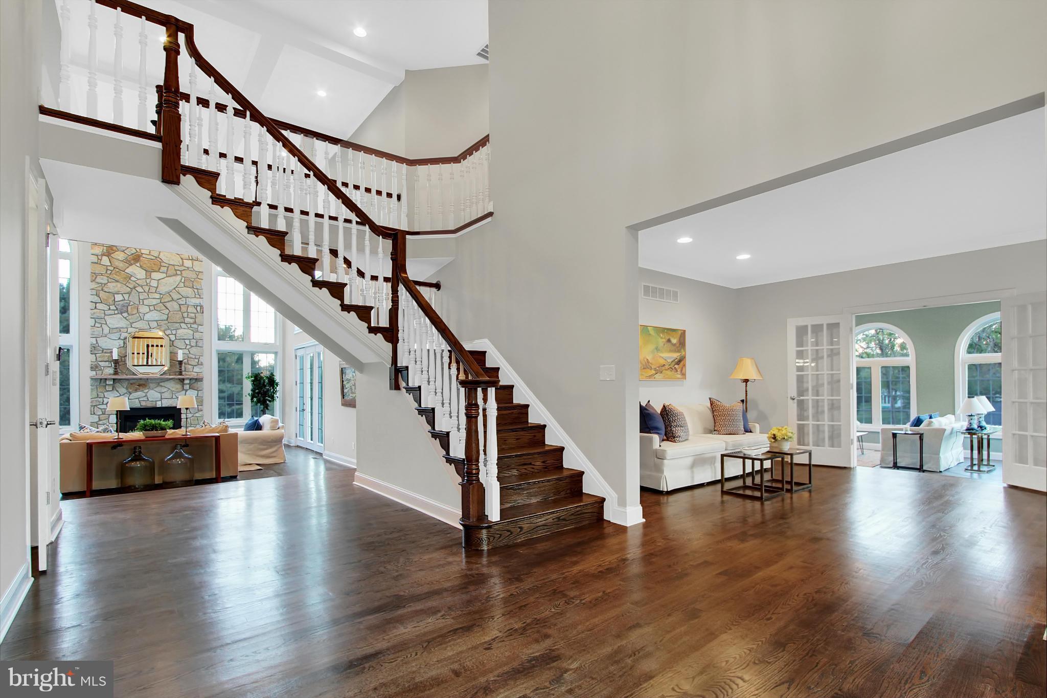 1904 Broadway Road Lutherville-Timonium, MD 21093 - Photo 7 of 30 a view of staircase with wooden floor and windows