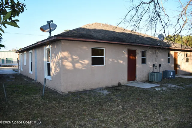 a front view of a house with yard