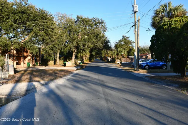a view of a street with houses