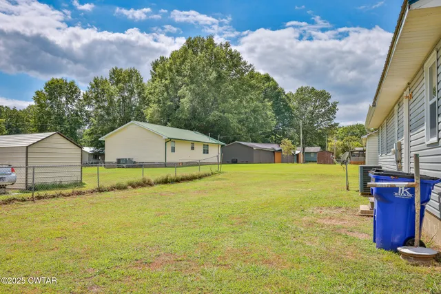 a swimming pool with some trees in the background