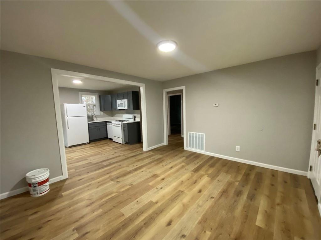 951 Tilden Street Northwest, Unit A Atlanta, GA 30318 - Photo 2 of 6 a view of an empty room and window