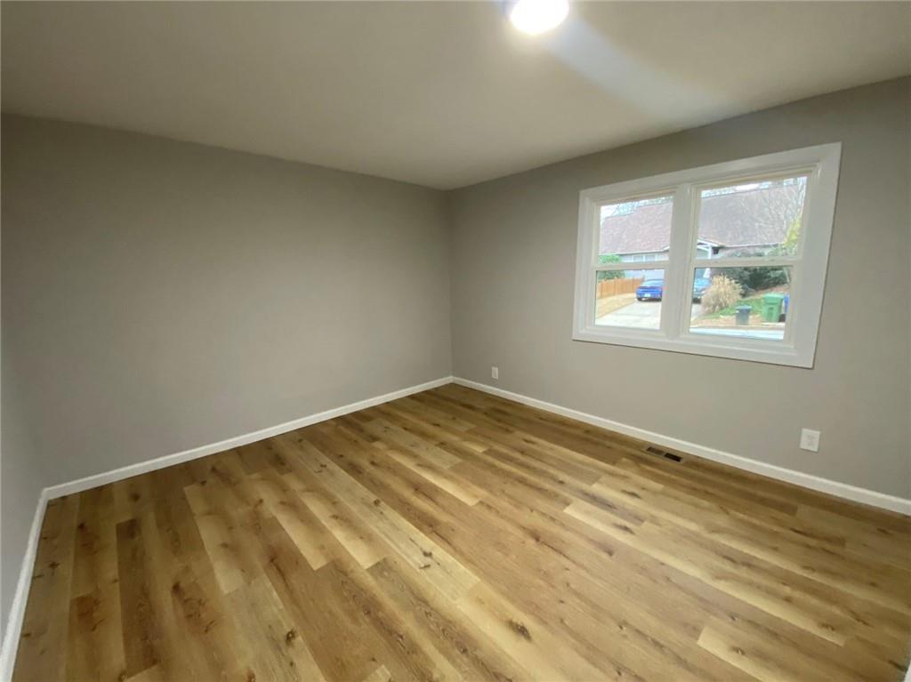 951 Tilden Street Northwest, Unit A Atlanta, GA 30318 - Photo 4 of 6 a view of an empty room and window