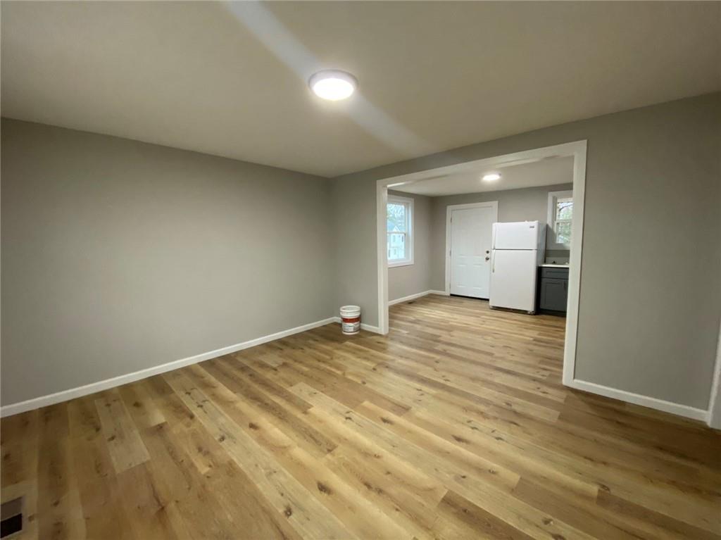 951 Tilden Street Northwest, Unit A Atlanta, GA 30318 - Photo 5 of 6 a view of an empty room and wooden floor