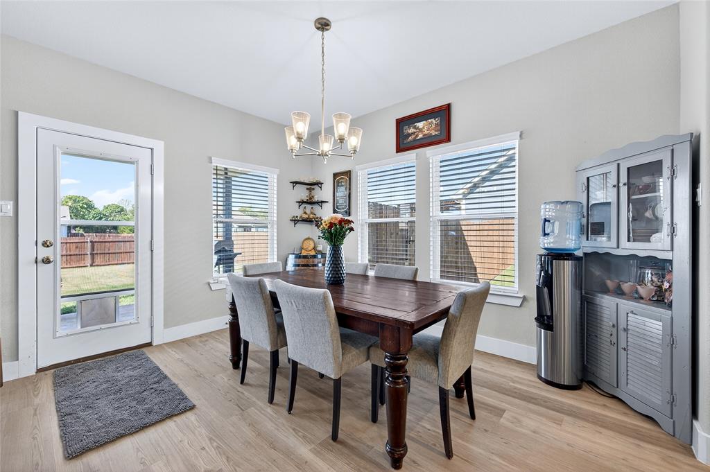608 Finlee Way Tioga, TX 76271 - Photo 13 of 35 a view of a dining room with furniture window and wooden floor
