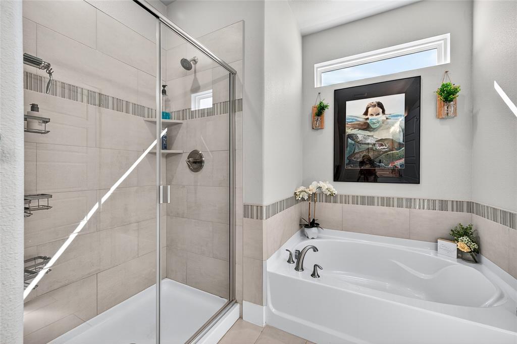 608 Finlee Way Tioga, TX 76271 - Photo 18 of 35 a bathroom with a tub a shower and a sink