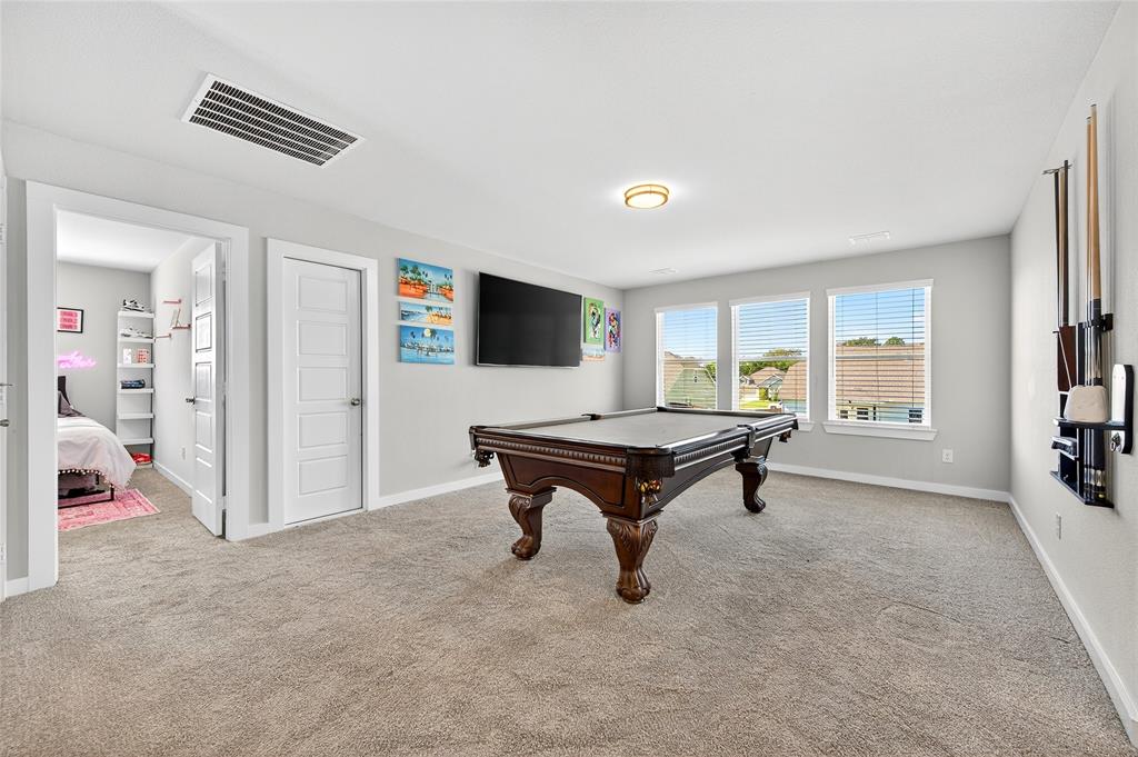 608 Finlee Way Tioga, TX 76271 - Photo 25 of 35 a living room with furniture and a flat screen tv