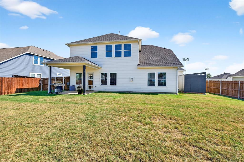 608 Finlee Way Tioga, TX 76271 - Photo 33 of 35 a front view of a house with a yard