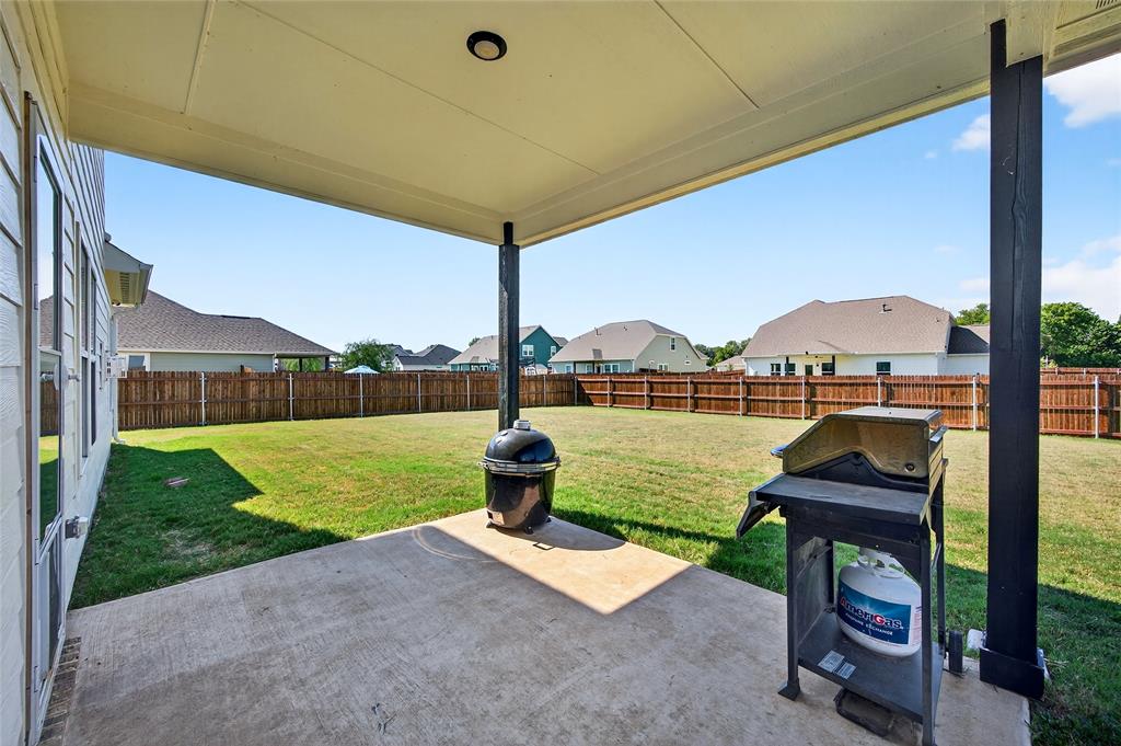 608 Finlee Way Tioga, TX 76271 - Photo 34 of 35 a house view with a garden and outdoor seating space