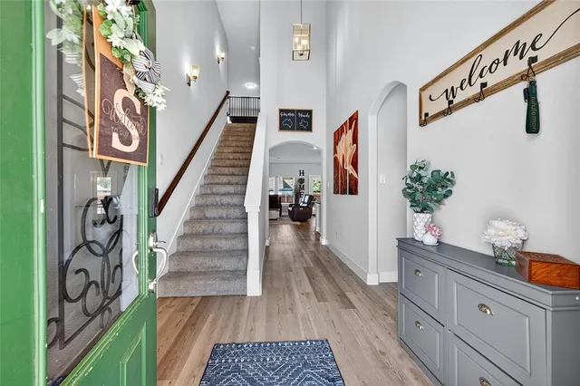 a view of stairs and with wooden floor
