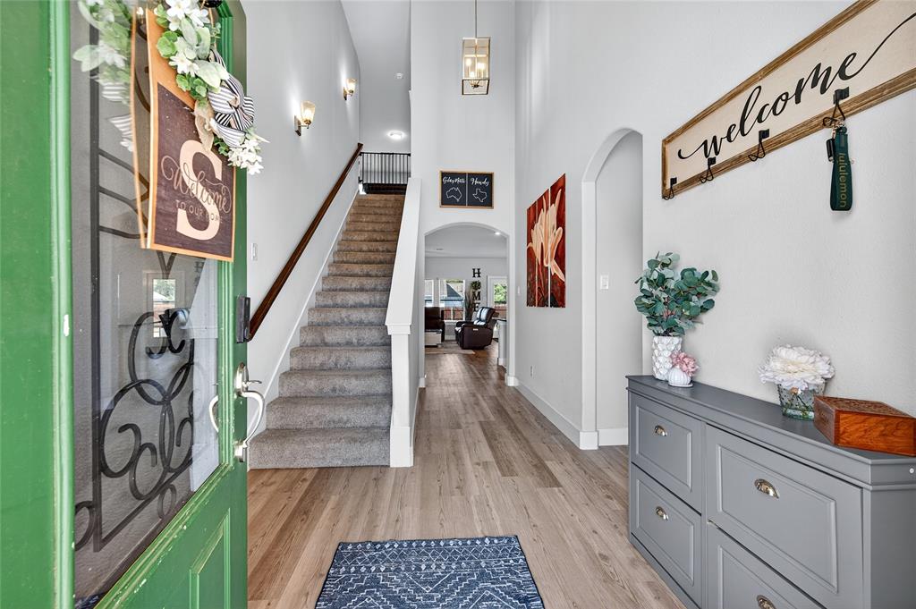 608 Finlee Way Tioga, TX 76271 - Photo 6 of 35 a view of stairs and with wooden floor