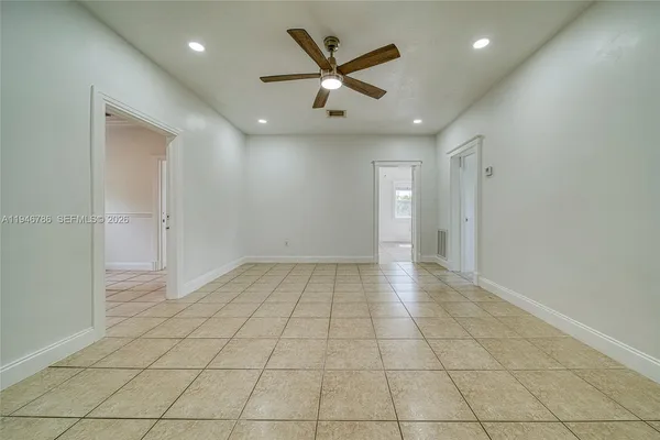 a view of an empty room with a window