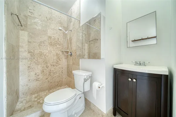 a view of an empty room and window chandelier fan