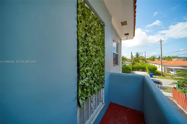 swimming pool view with a seating space