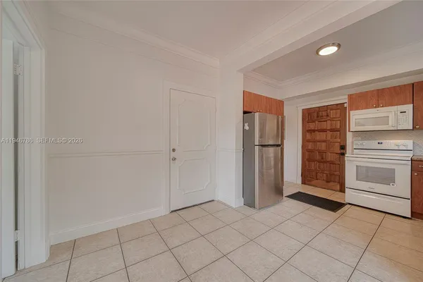 a view of cabinets and window in a room