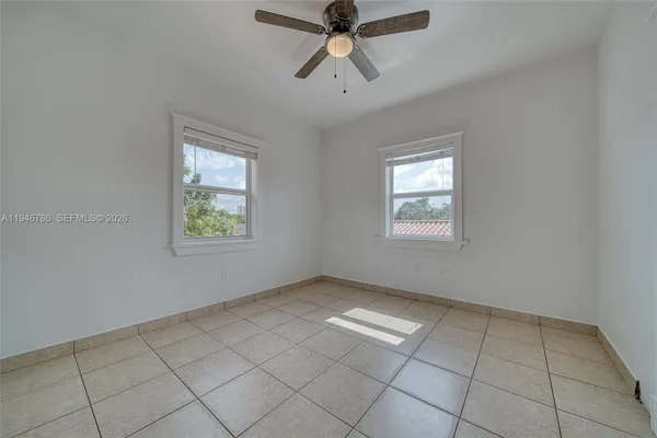 a view of an empty room and window
