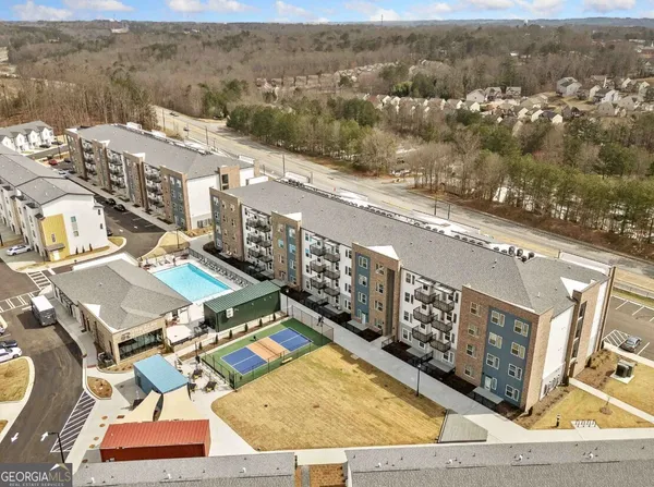 an aerial view of residential houses with outdoor space