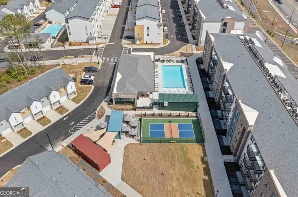 an aerial view of a house with outdoor space