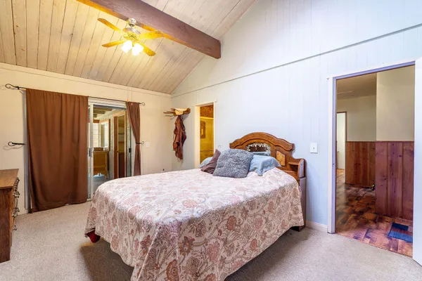a bedroom with a bed and a closet