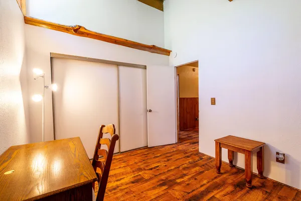 a view of a room with a table and chairs